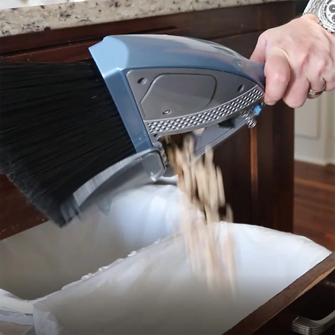 Removable dust container of a compact vacuum broom