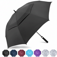 Windproof golf umbrella with double canopy design for strong winds