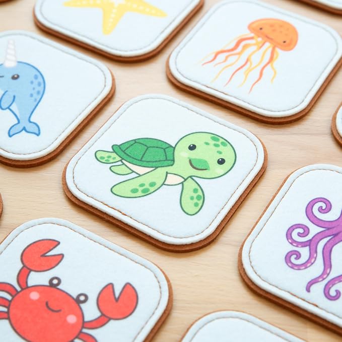 Wooden matching puzzle cards featuring cute sea animal illustrations for interactive play