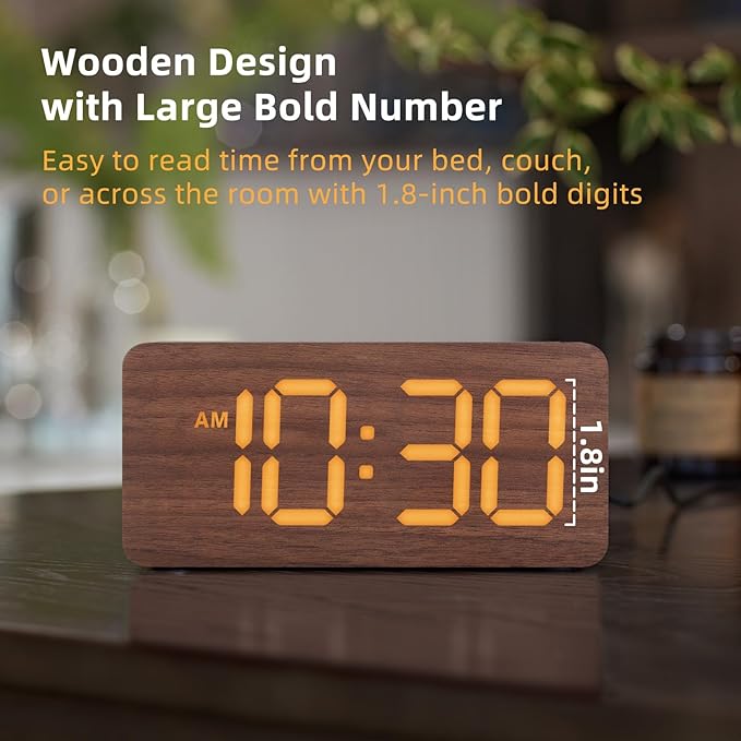 Wooden digital alarm clock placed on bedroom bedside desk