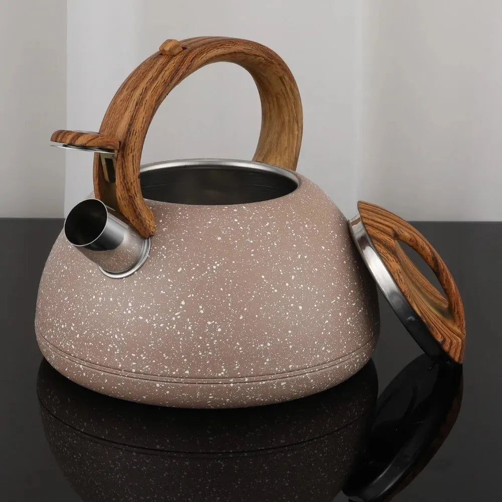 Silver stovetop tea kettle with wooden-style handle