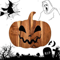 Wooden pumpkin serving board displaying cheese and crackers