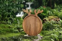 Wooden serving board with decorative reindeer antler detail