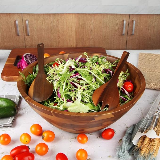 wooden salad bowl with matching serving utensils